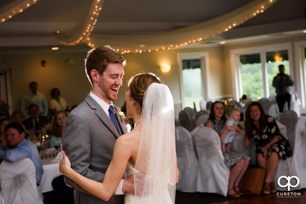 Bride and groom having their first dance at the wedding reception.