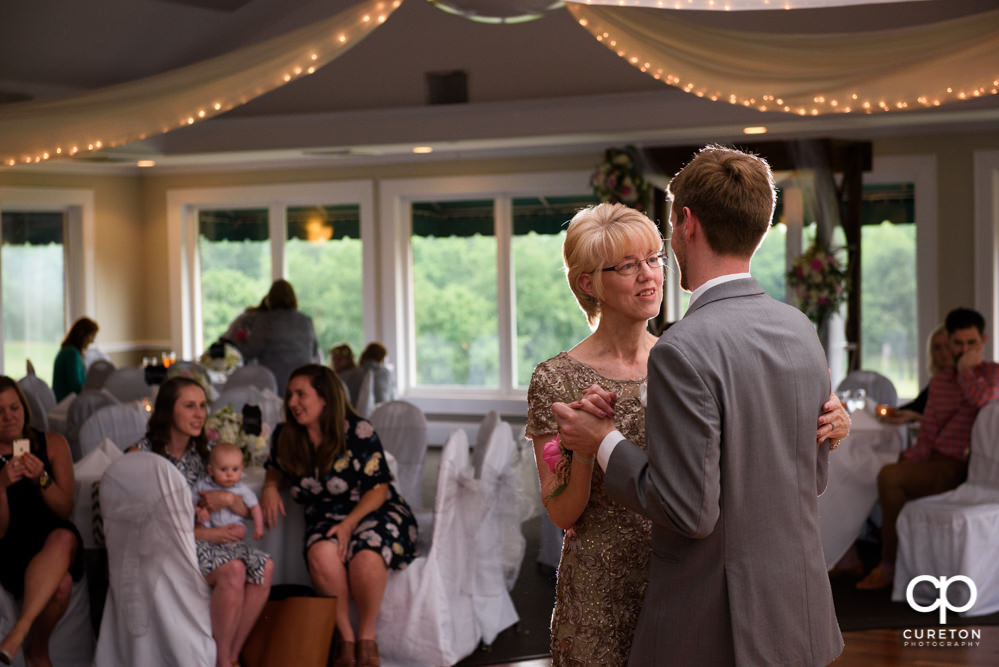 Groom and his mother dancing at the reception.