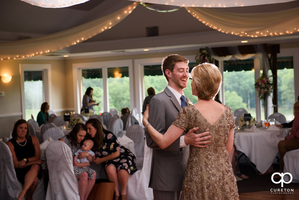 Groom and his mother dancing at the reception.
