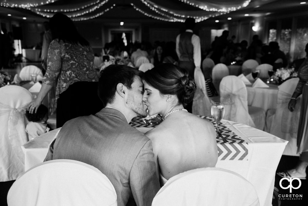 Bride and Groom kissing at the reception.