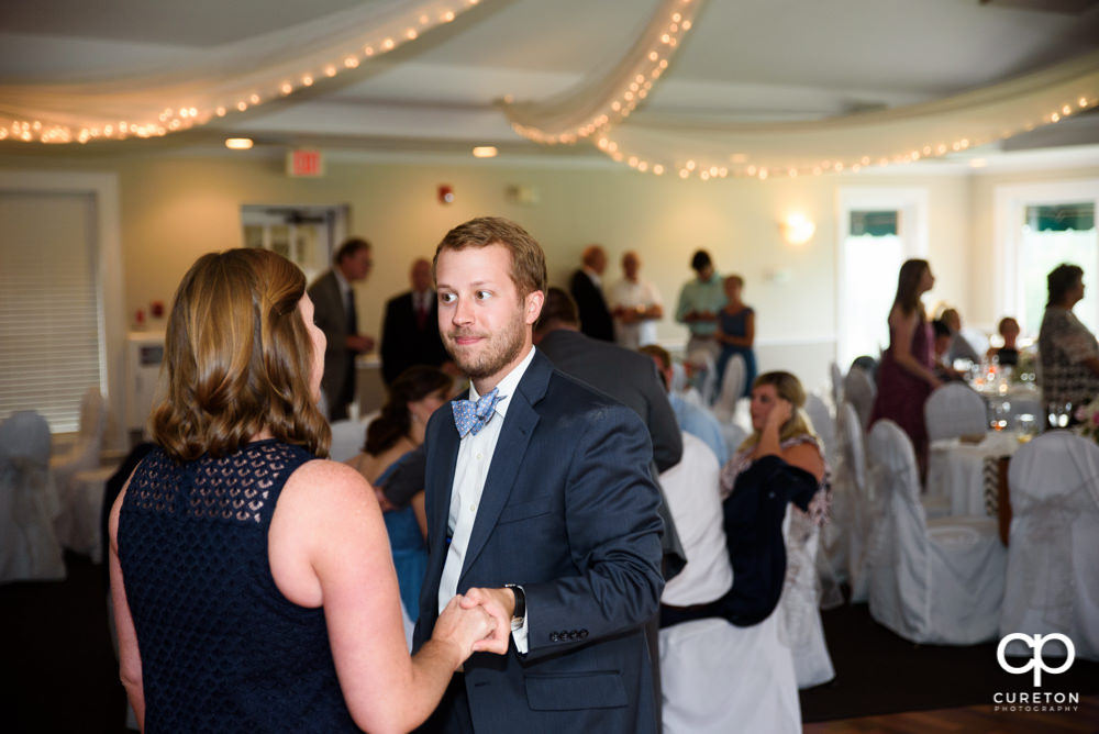 Guests dancing at the wedding reception.