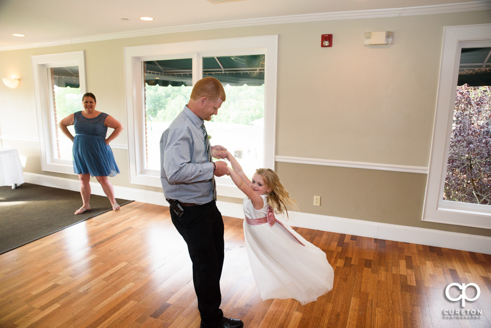 Guests dancing at the wedding reception.