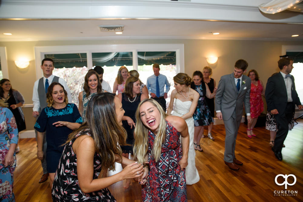 Guests dancing at the wedding reception.