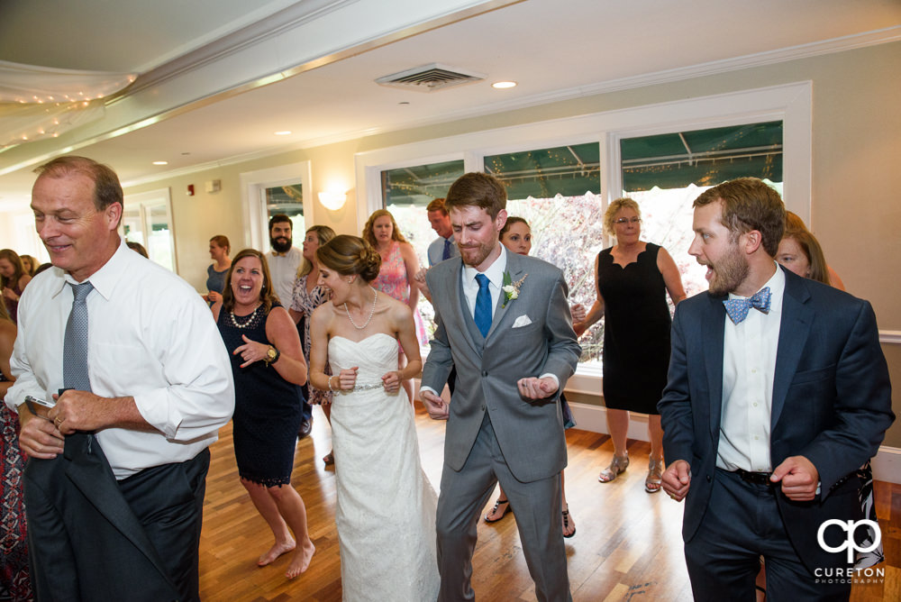 Guests dancing at the wedding reception.