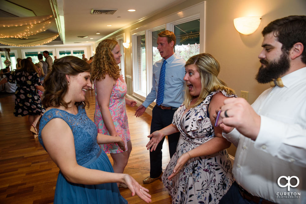 Guests dancing at the wedding reception.