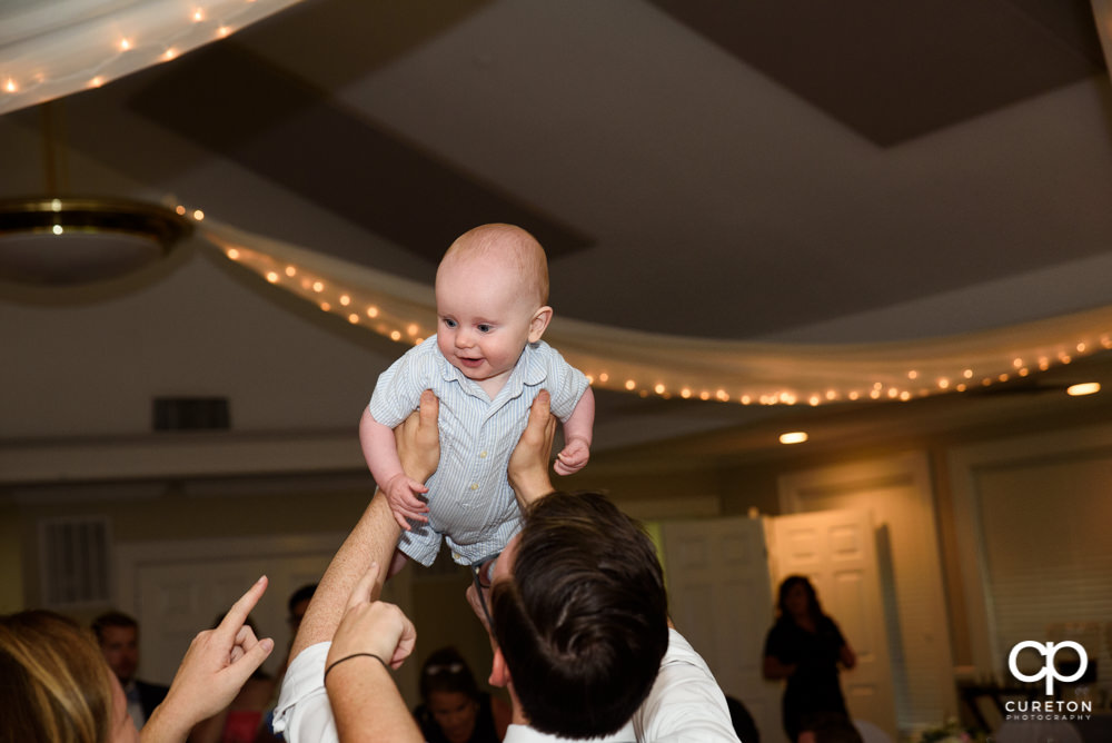 Guests dancing at the wedding reception.