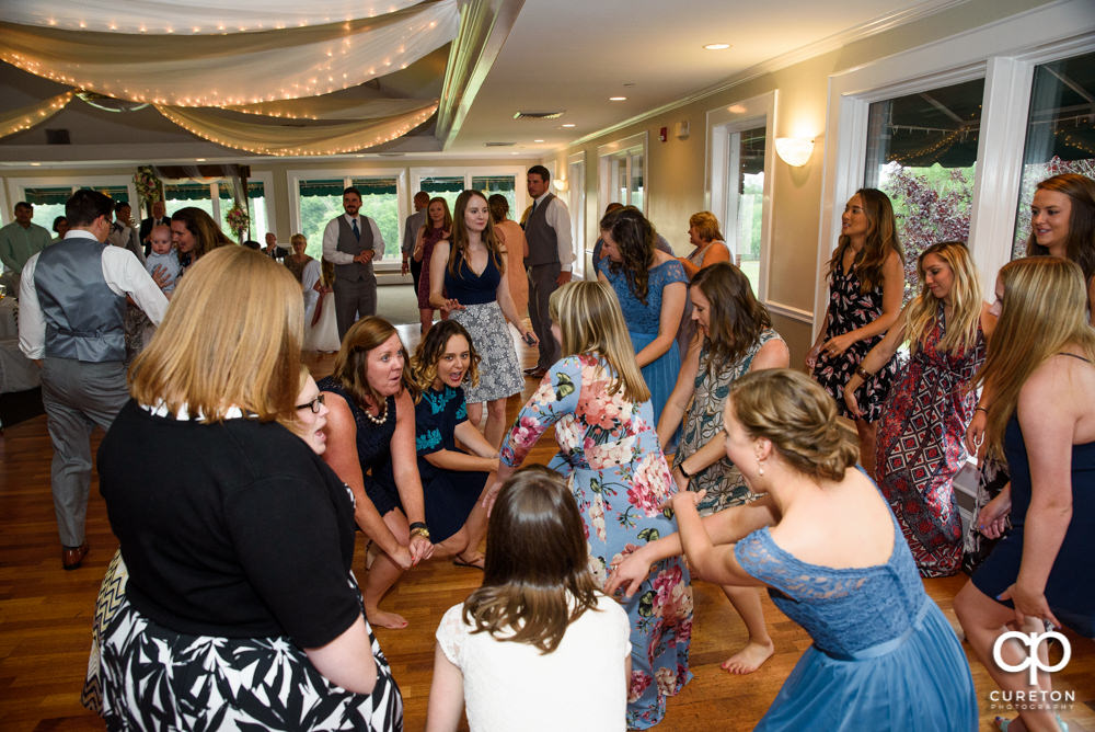 Guests dancing at the wedding reception.
