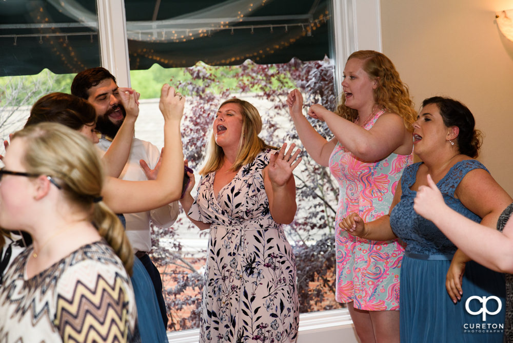 Guests dancing at the wedding reception.