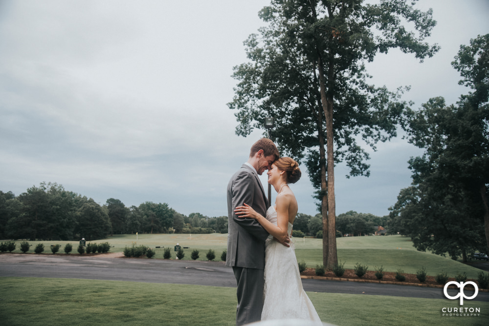 Bride and groom on the golf course.
