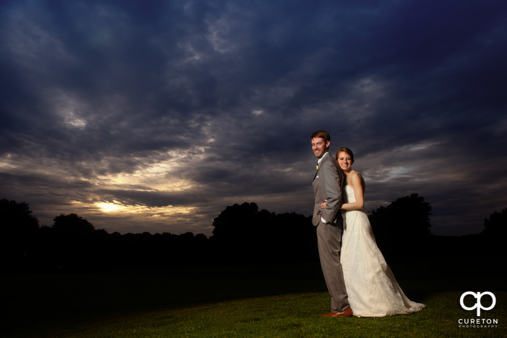 Bride and groom at sunset.