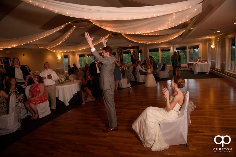 Groom tossing the garter.