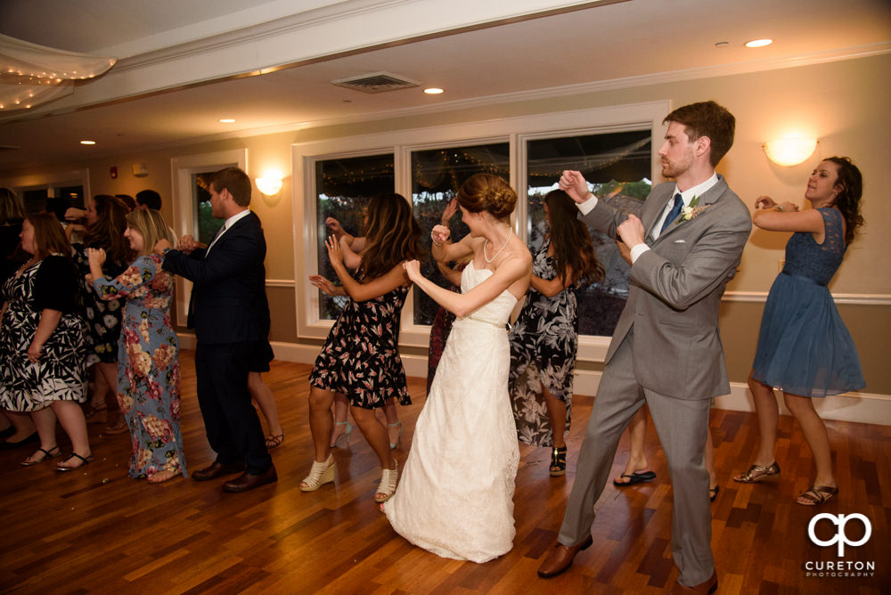 Wedding guests dancing.
