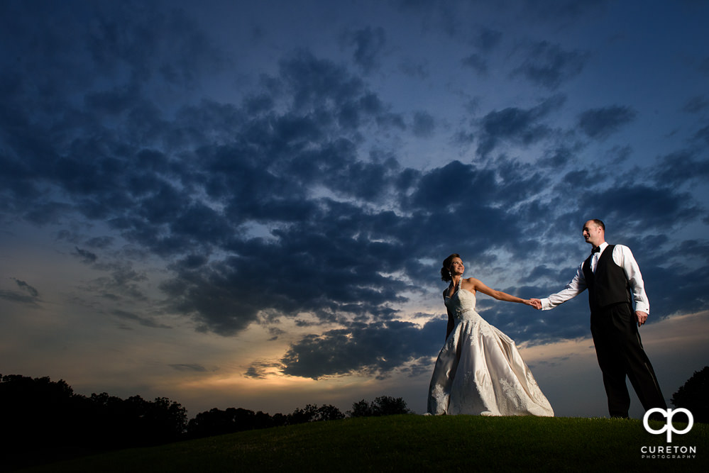 Bride and Groom at sunset after their Holly Tree Country Club wedding