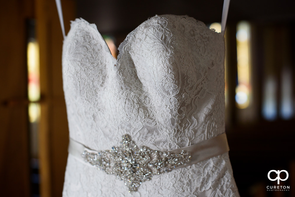 Closeup detail in the bride's dress.