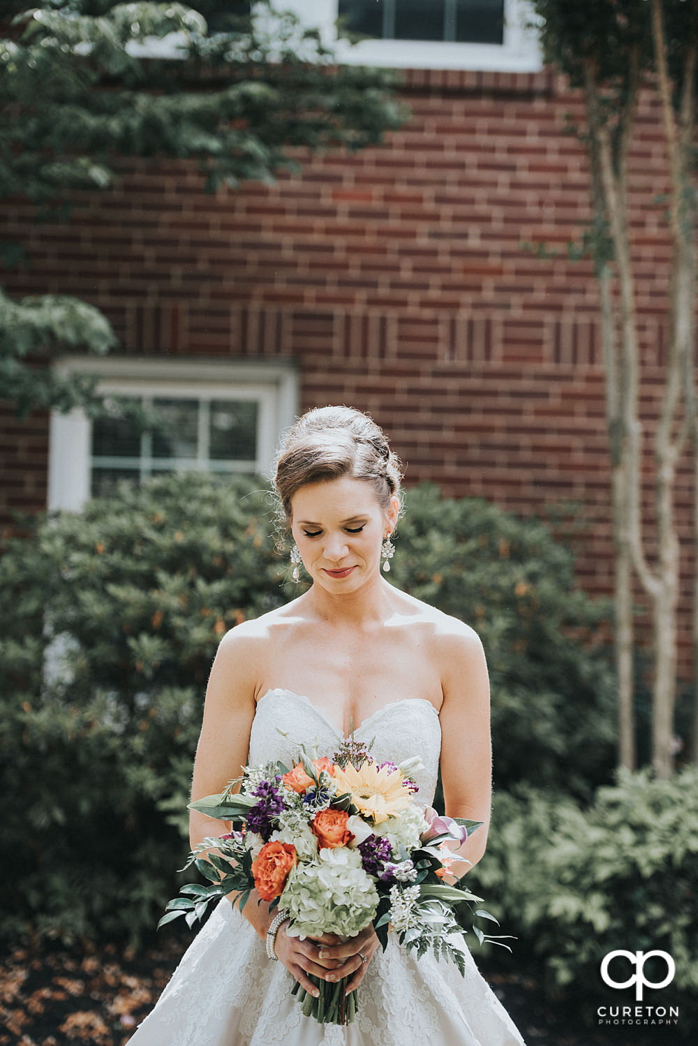 Bride in the courtyard at Mauldin United Methodist Church.