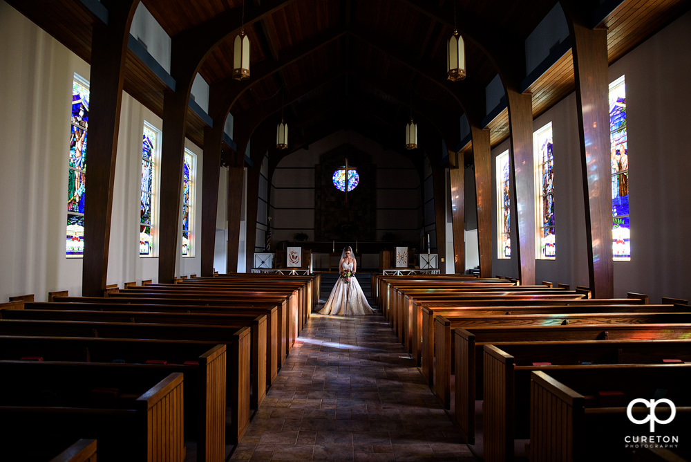 Bride in the sanctuary at Mauldin United Methodist after their wedding.