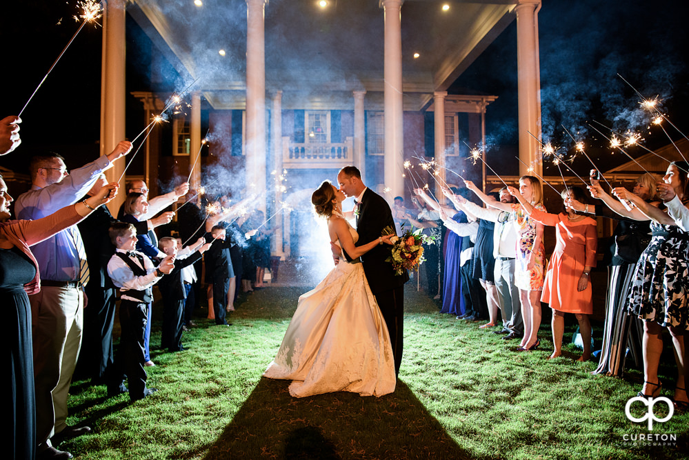 Bride and groom's sparkler leave at the Holly Tree Country Club wedding reception.