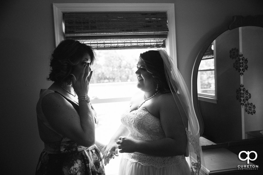 Bride's mom crying during the getting ready portion of the wedding day.