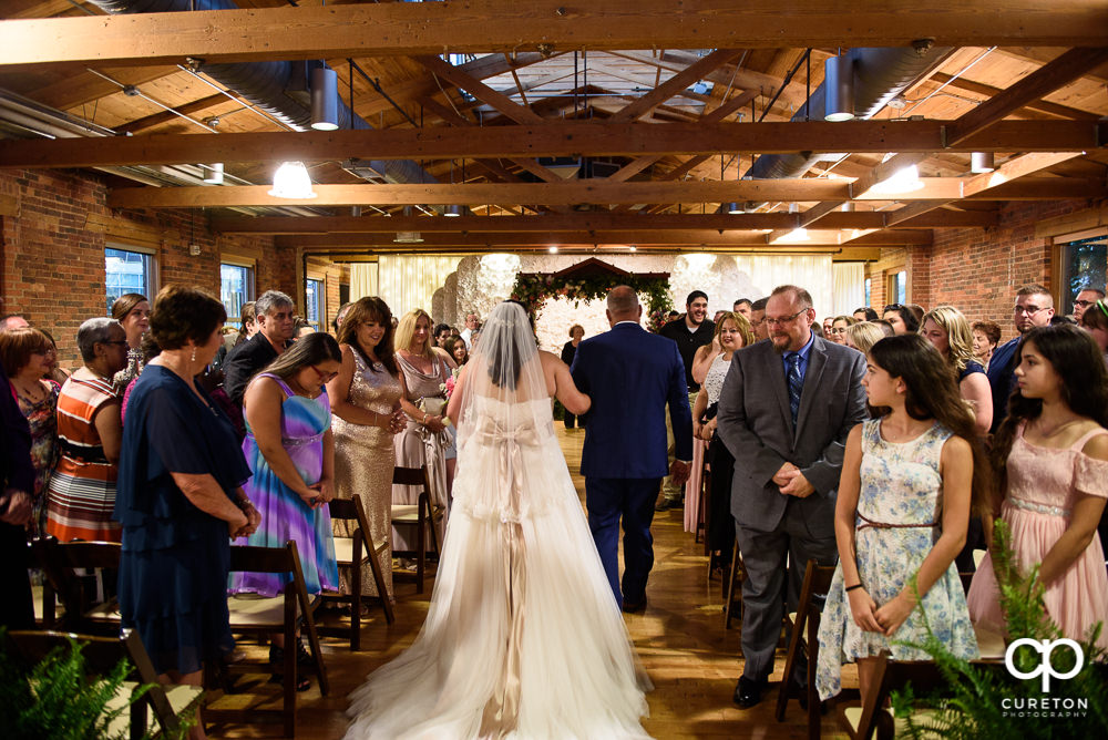 Bride and her father walking down the aisle at the Huguenot Loft wedding in Greenville,SC