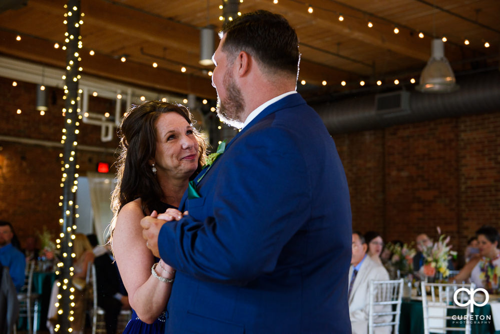 Groom and his mom having a dance at the reception.