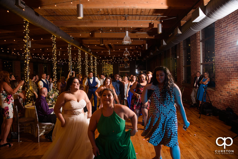 Wedding guests dancing.