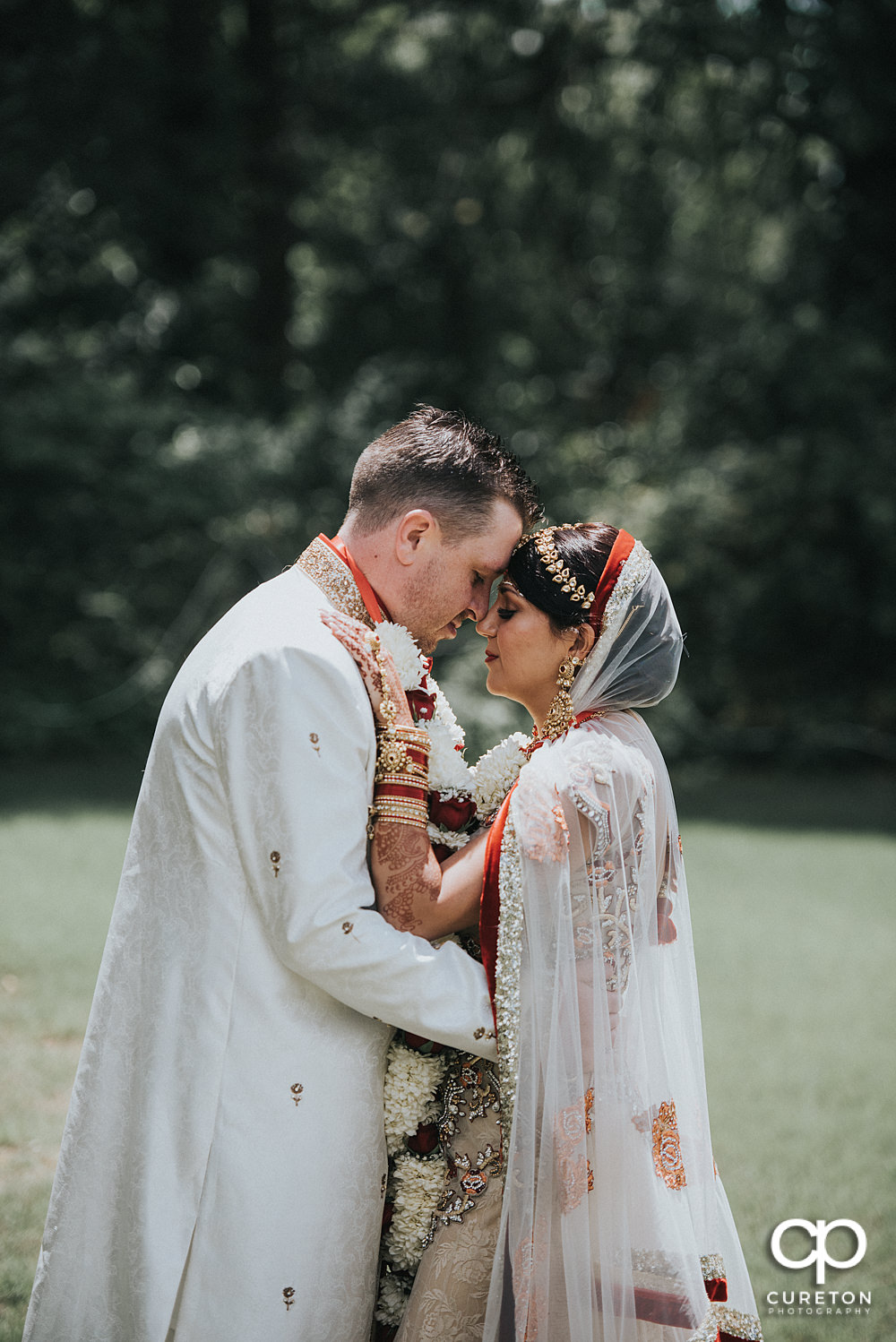 Bride and groom outside after their Indian wedding at Embassy Suites in Greenville,SC.