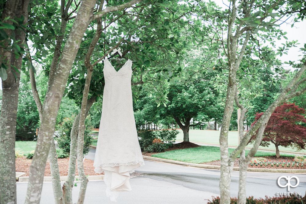 Wedding dress hanging.