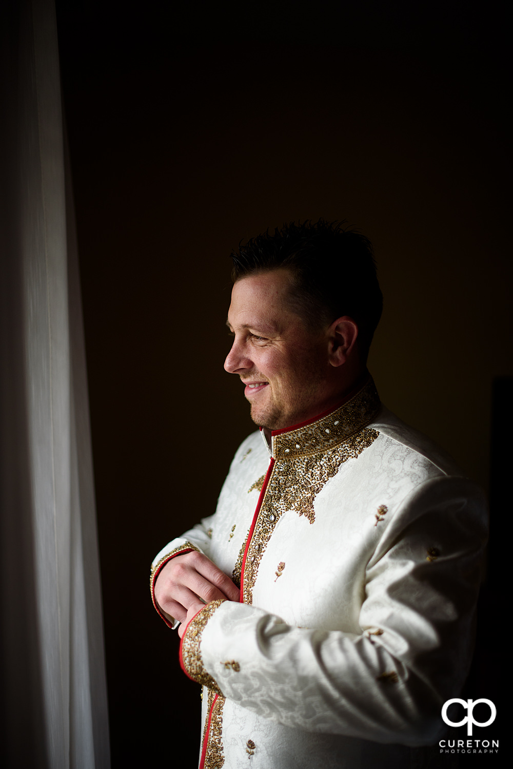 Indian groom getting ready.