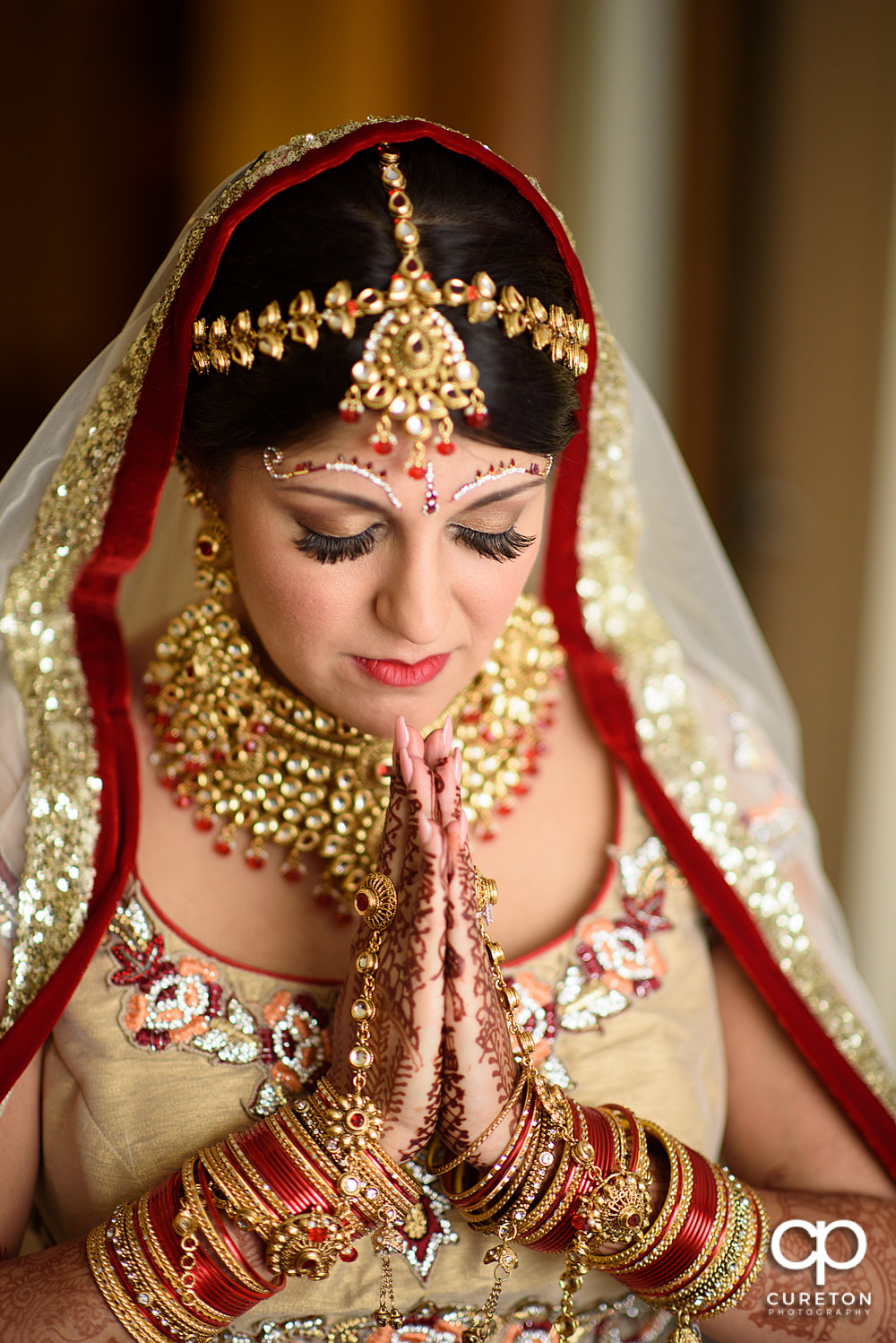 Indian bride getting ready for her wedding at Embassy Suites in Greenville.