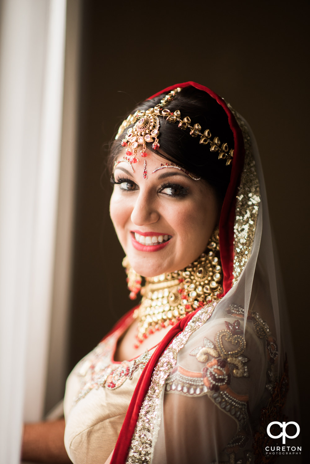 Indian bride getting ready for her wedding at Embassy Suites in Greenville.