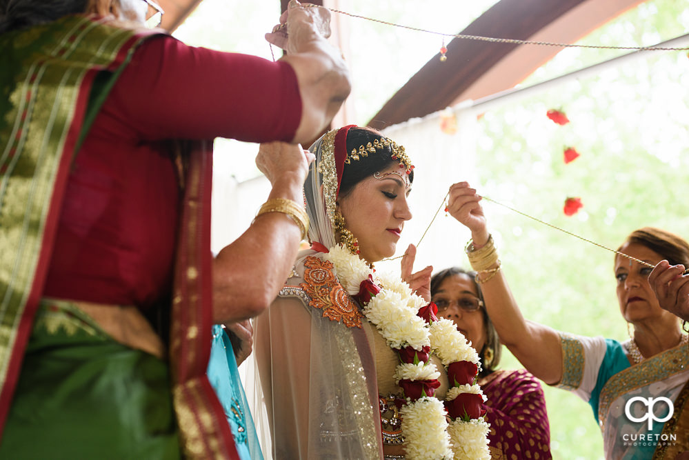 Outdoor Indian wedding ceremony at Embassy Suites hotel in Greenville SC.