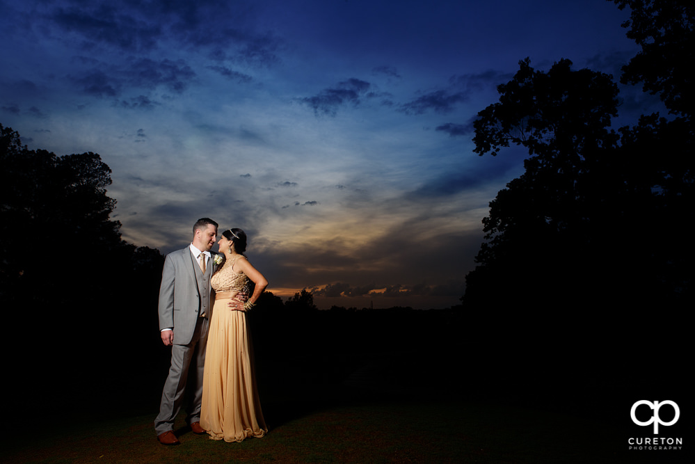 Bride and groom at sunset after their Greenville Indian wedding.