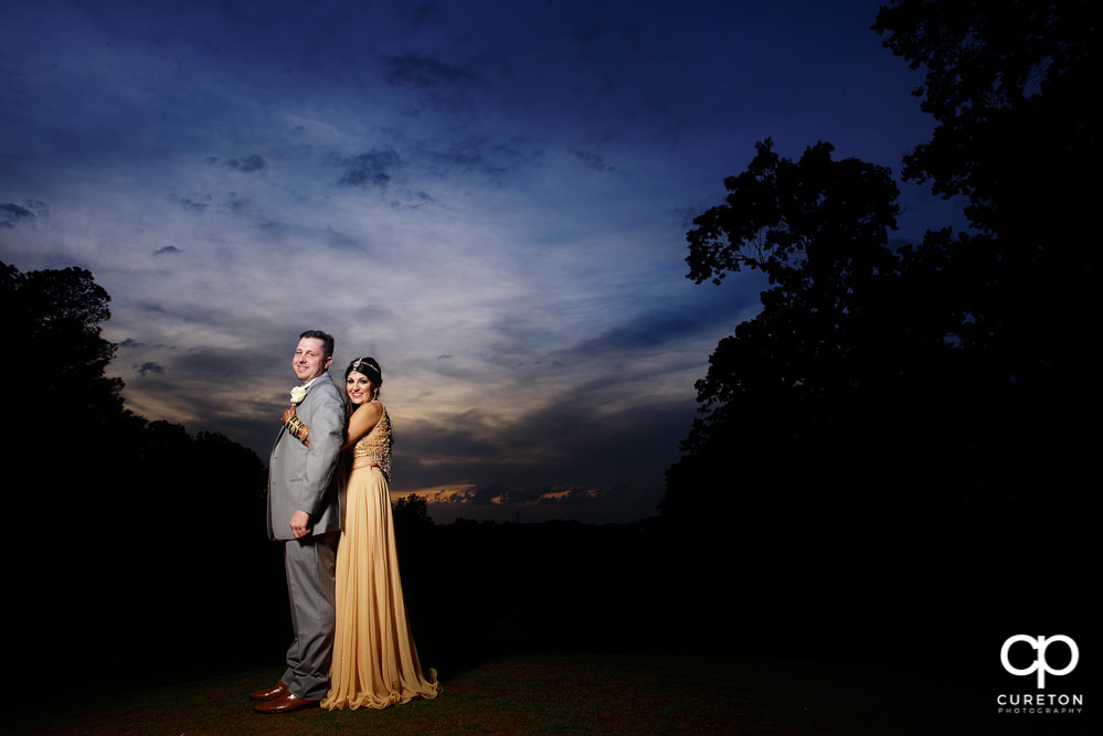 Bride and groom at sunset after their Greenville Indian wedding.