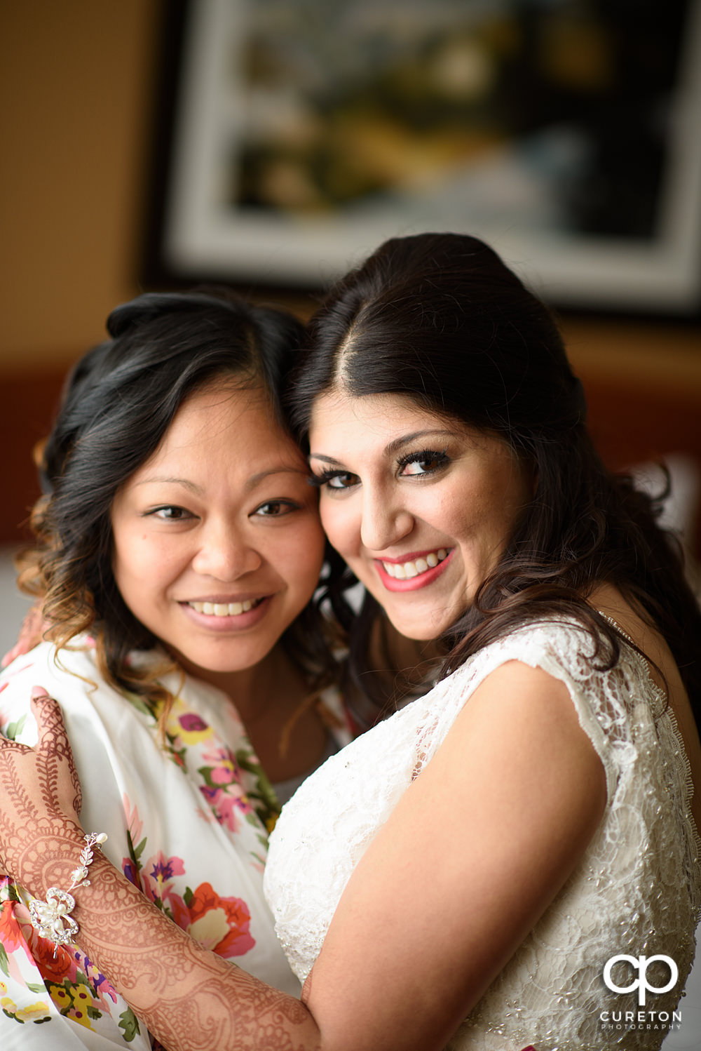 Bride getting ready in a room at Embassy Suites hotel in Greenville.