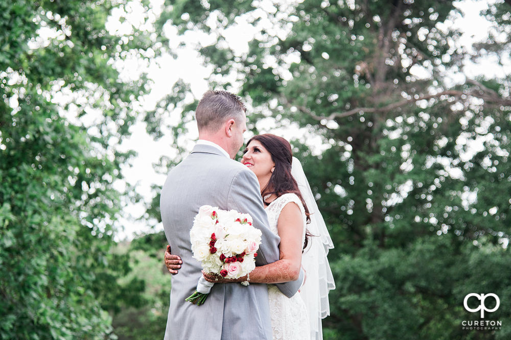 Bride and groom on the golf course at Embassy Suites.