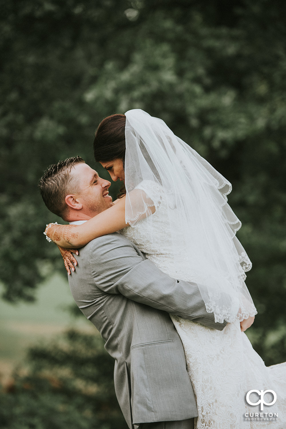 Bride and groom on the golf course at Embassy Suites.