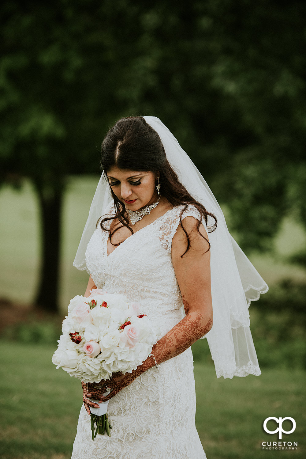 Bride and groom on the golf course at Embassy Suites.