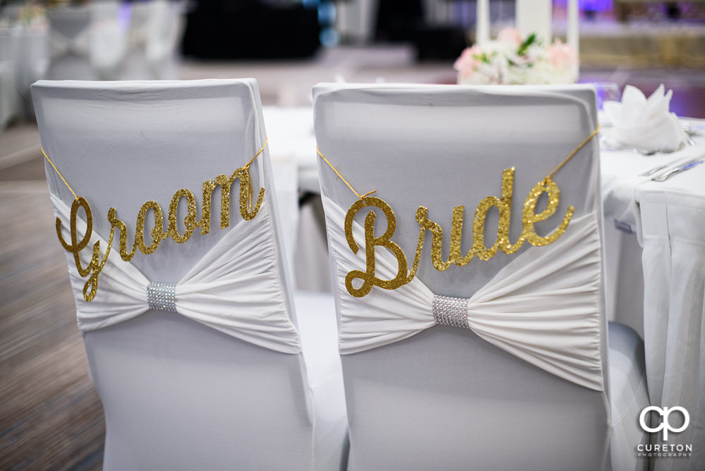 Bride and groom's chairs.