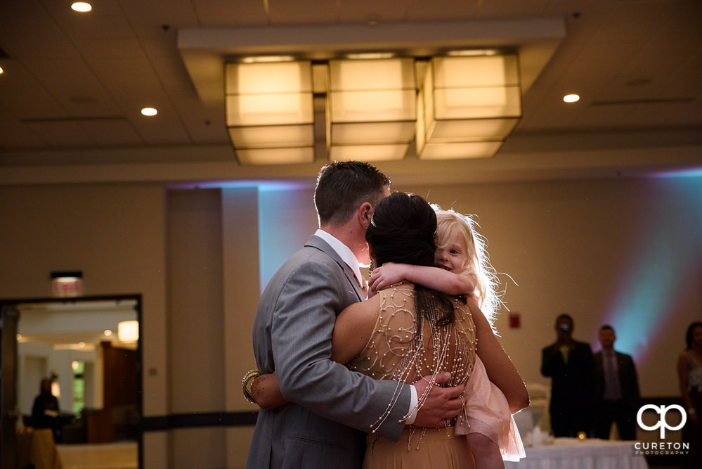 Bride and groom share a first dance at the wedding reception at Embassy Suites in Greenville.