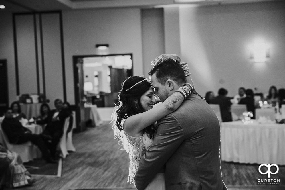 Bride and groom share a first dance at the wedding reception at Embassy Suites in Greenville.