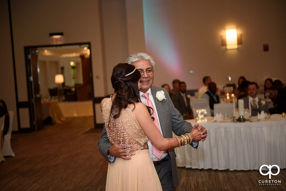 Bride and father dance.