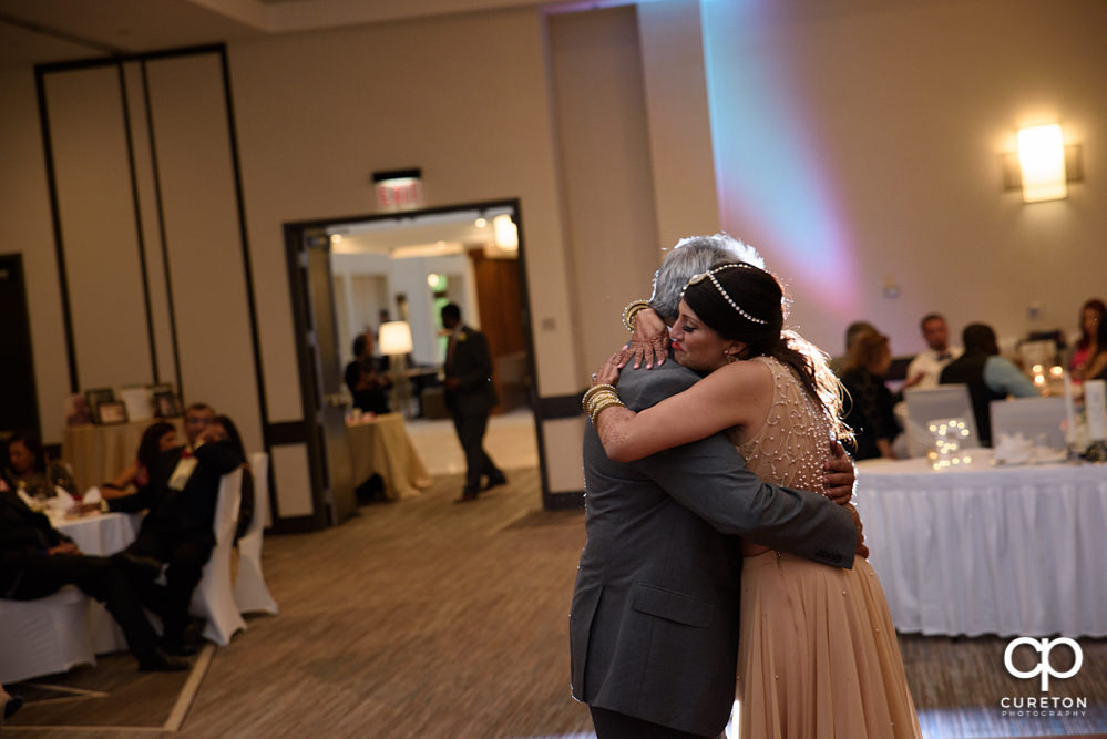 Bride and father dance.