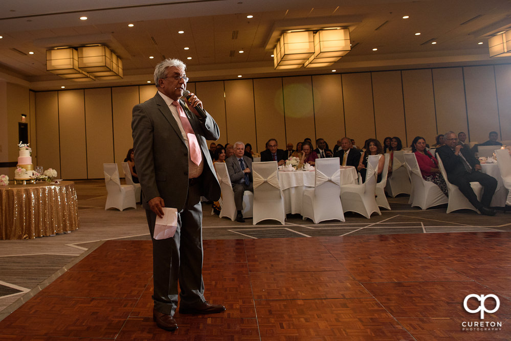 Bride's father making a toast.