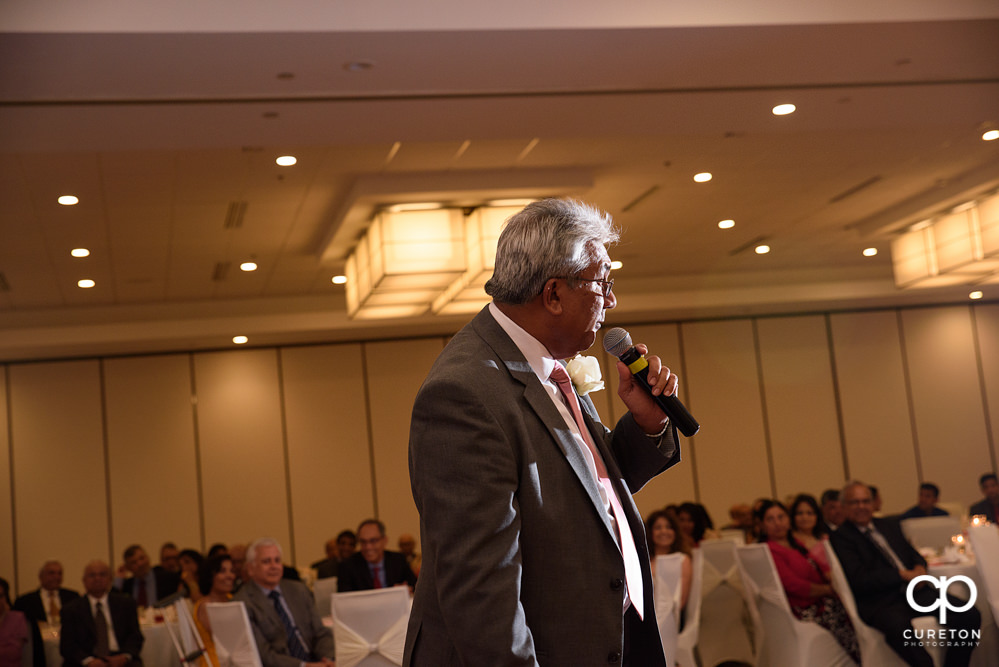 Bride's father making a toast.