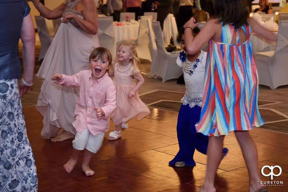 Wedding guests dancing at the reception.