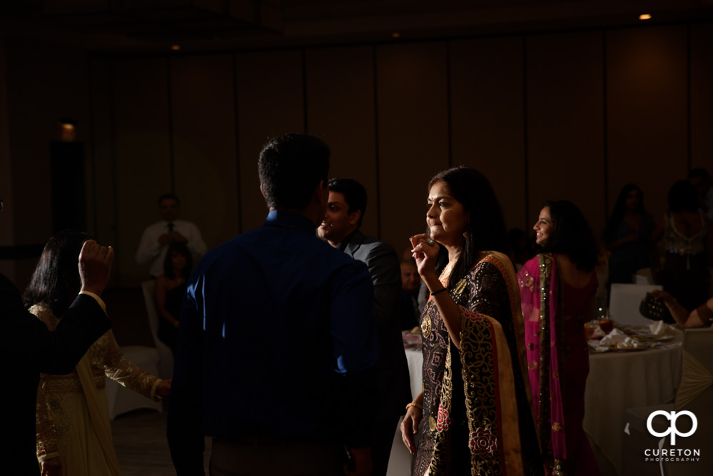 Wedding guests dancing at the reception.