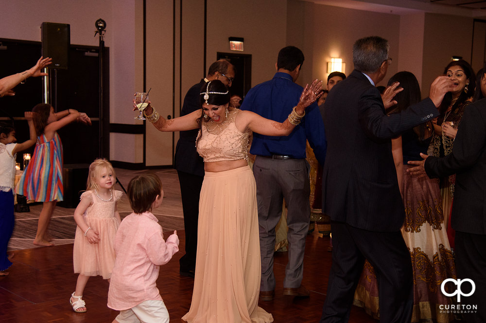 Wedding guests dancing at the reception.