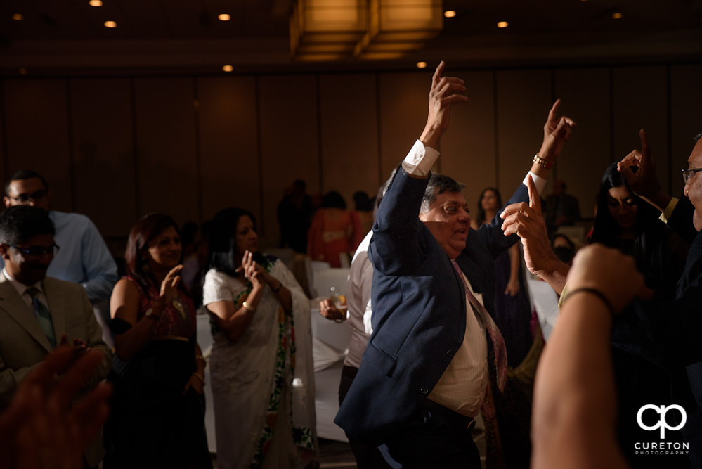 Wedding guests dancing at the reception.