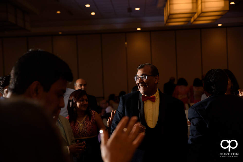 Wedding guests dancing at the reception.