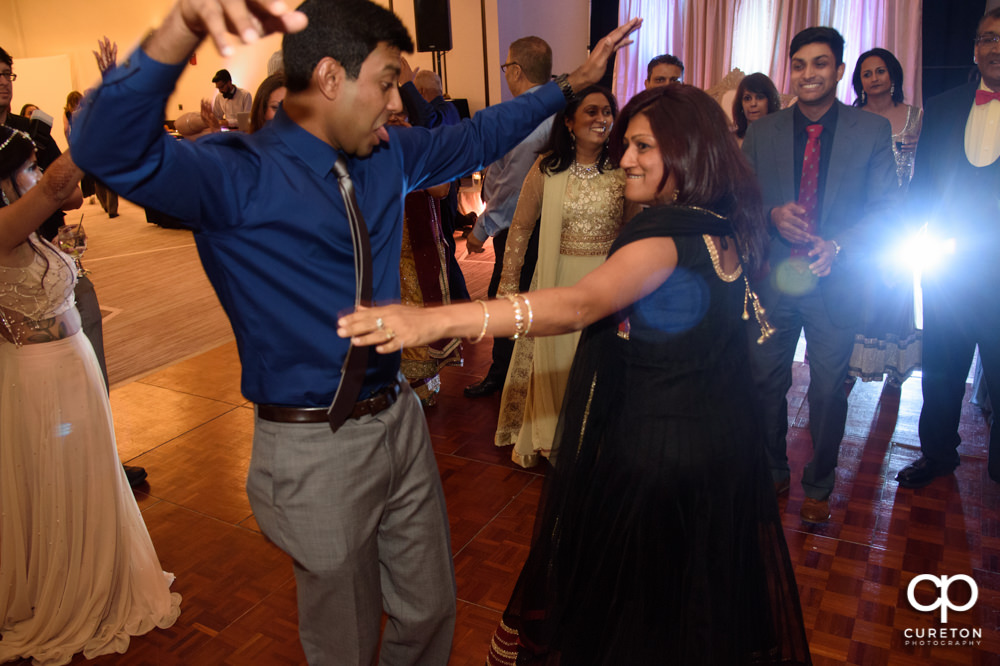 Wedding guests dancing at the reception.